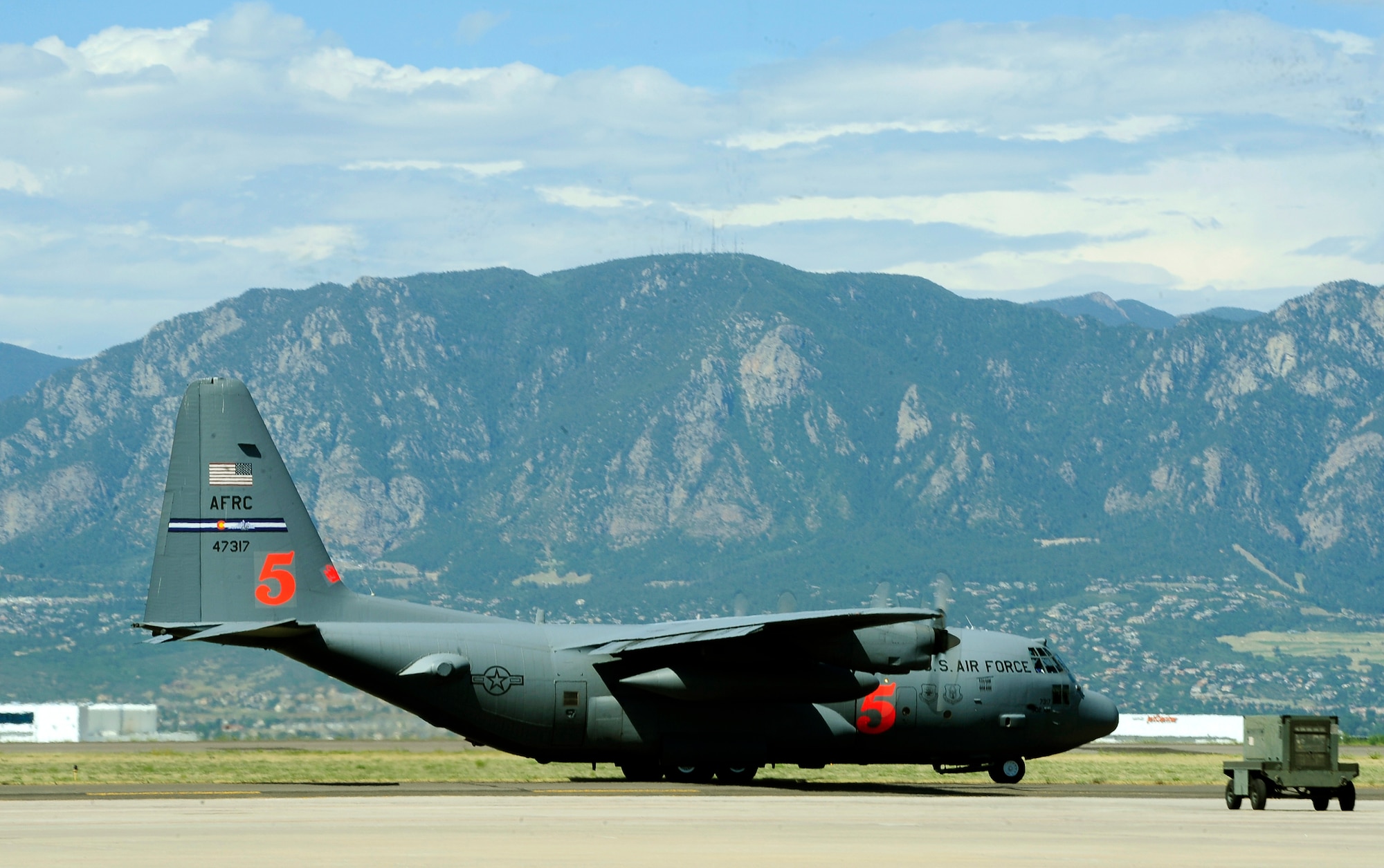 An Air Force Reserve Modular Airborne Fire Fighting System-equipped C-130 Hercules aircraft taxis down the runway June 27 at Peterson Air Force Base, Colo., to help battle the Waldo Canyon Fire near Colorado Springs, Colo. MAFFS is a self-contained aerial firefighting system that can discharge 3,000 gallons of water or fire retardant in less than five seconds, covering an area one-quarter of a mile long by 100 feet wide. (U.S. Air Force photo/Staff Sgt. Stephany D. Richards)