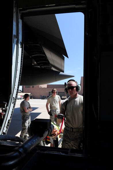 Air Force Reservists from the 302nd Maintenance Group prepare a Modular Airborne Fire Fighting System-equipped C-130 Hercules aircraft June 27 before it launches from Peterson Air Force Base to help fight the Waldo Canyon Fire near Colorado Springs, Colo. MAFFS is a self-contained aerial firefighting system that can discharge 3,000 gallons of water or fire retardant in less than five seconds, covering an area one-quarter of a mile long by 100 feet wide. The 302nd MXG, a subordinate organization to the 302nd Airlift Wing, is based at Peterson AFB, an Air Force installation located in southern Colorado. (U.S. Air Force photo/Staff Sgt. Stephany D. Richards)