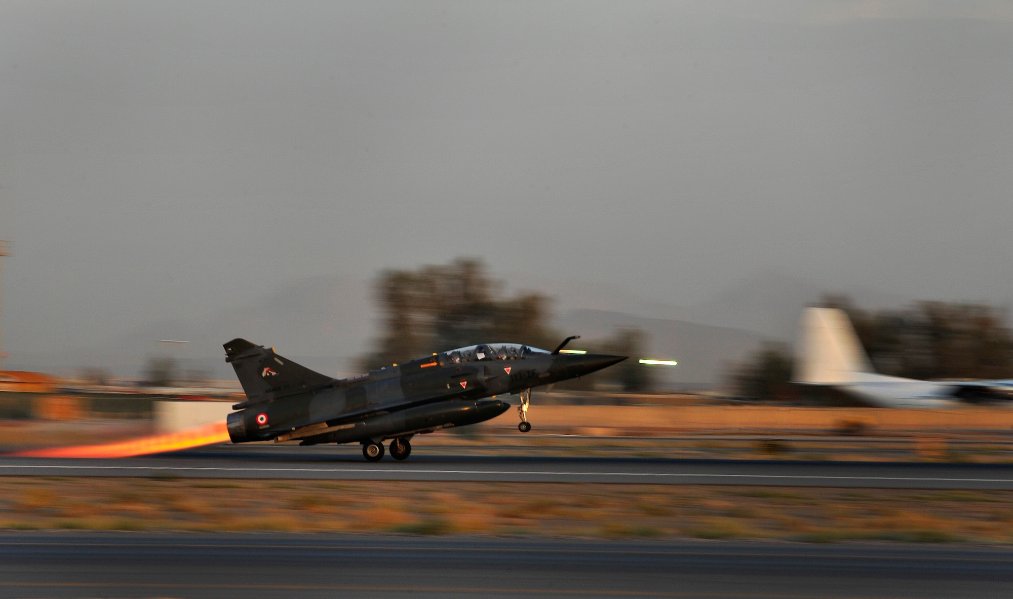 Members of the French Air Force, Detachment 3/3, in the Mirage 2000-D takeoff during a combat mission at Kandahar Airfield, Afghanistan, June 18, 2012. Approximately 3,000 French troops are currently deployed in support of OEF and ISAF. Of that, approximately 300 FAF Airmen are stationed in Afghanistan, Tajikistan and Southwest Asia.(U.S. Air Force photo/Staff Sgt. Clay Lancaster)
