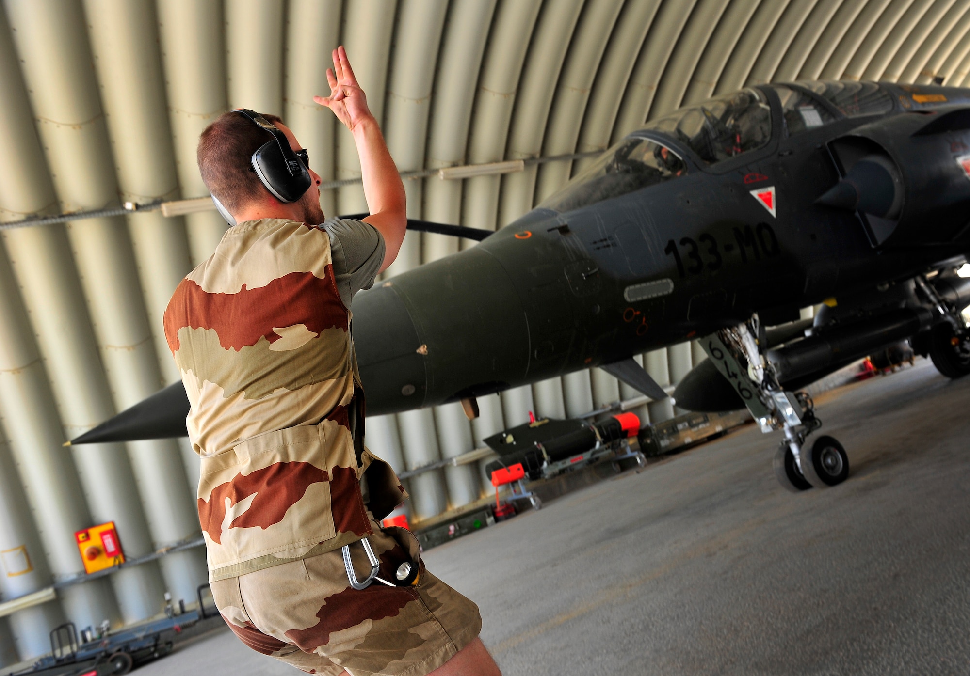 Members of the French Air Force, Detachment 3/3, perform maintenance inspections and checklists on a Mirage 2000-D before a combat mission at Kandahar Airfield, Afghanistan, June 15, 2012. The French AF has been a coalition partner with the U.S. during Operation Enduring Freedom (OEF) and perform air to ground close air support missions for friendly ground forces. (U.S. Air Force photo/Staff Sgt. Clay Lancaster)
