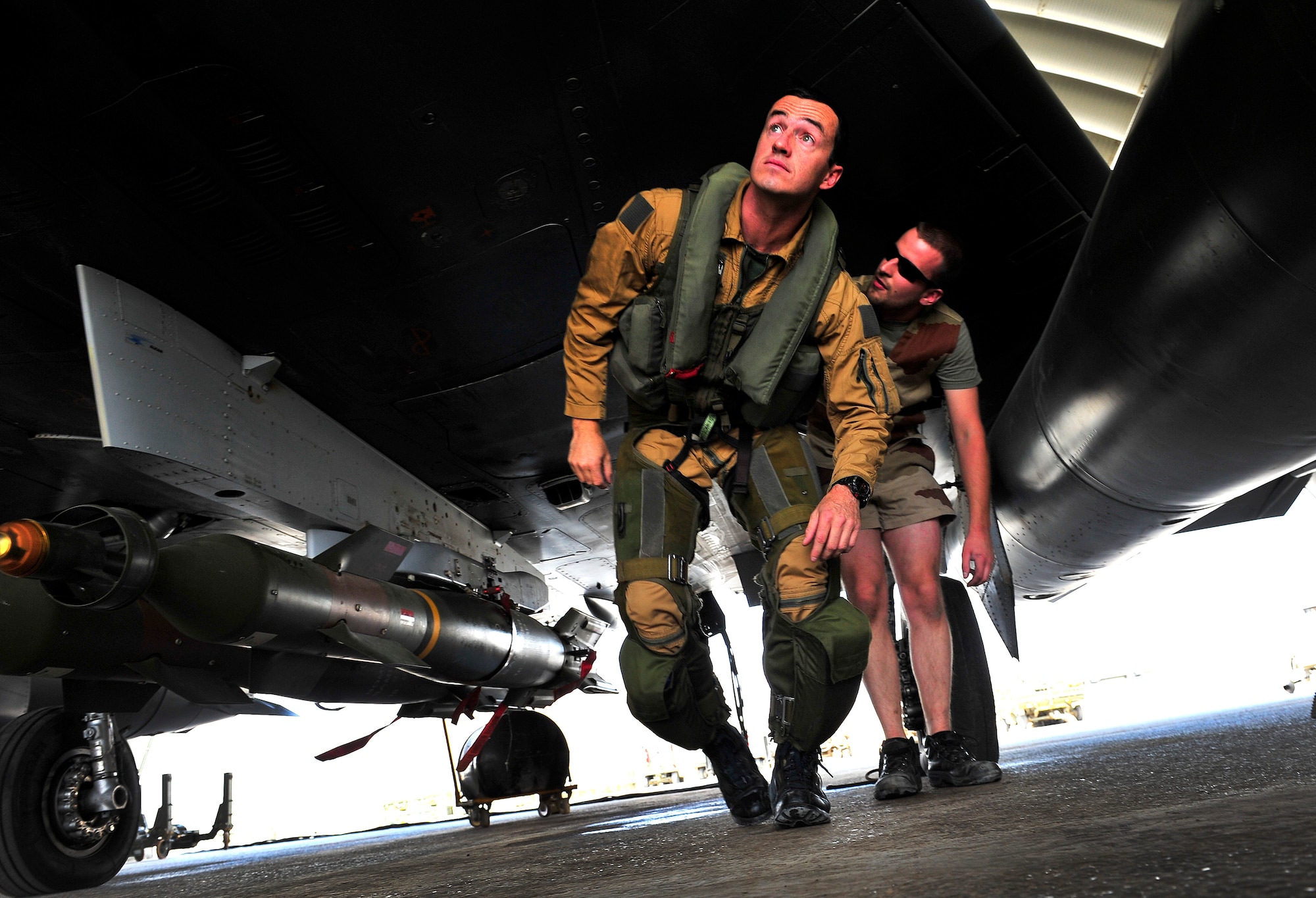 Members of the French Air Force, Detachment 3/3, perform maintenance inspections and checklists on a Mirage 2000-D before a combat mission at Kandahar Airfield, Afghanistan, June 15, 2012. The French AF has been a coalition partner with the U.S. during Operation Enduring Freedom (OEF) and perform air to ground close air support missions for friendly ground forces. (U.S. Air Force photo/Staff Sgt. Clay Lancaster)
