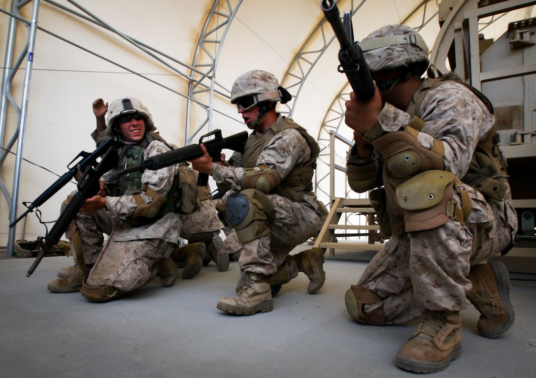 MARINE CORPS AIR GROUND COMBAT CENTER TWENTYNINE PALMS, Calif. - Marines with Company C, 4th Combat Engineer Battalion, Lynchburg, Va., form a security line after exiting a Mine Resistant Ambush Protected Vehicle Egress Trainer aboard Camp Wilson here July 4 during exercise Javelin Thrust 2012. Javelin Thrust is an annual large-scale exercise which allows active and reserve Marines and Sailors from 38 different states to train together as a seamless Marine Air Ground Task Force. (U.S. Marine Corps photo by Sgt. Alvin D. Parson/Released)