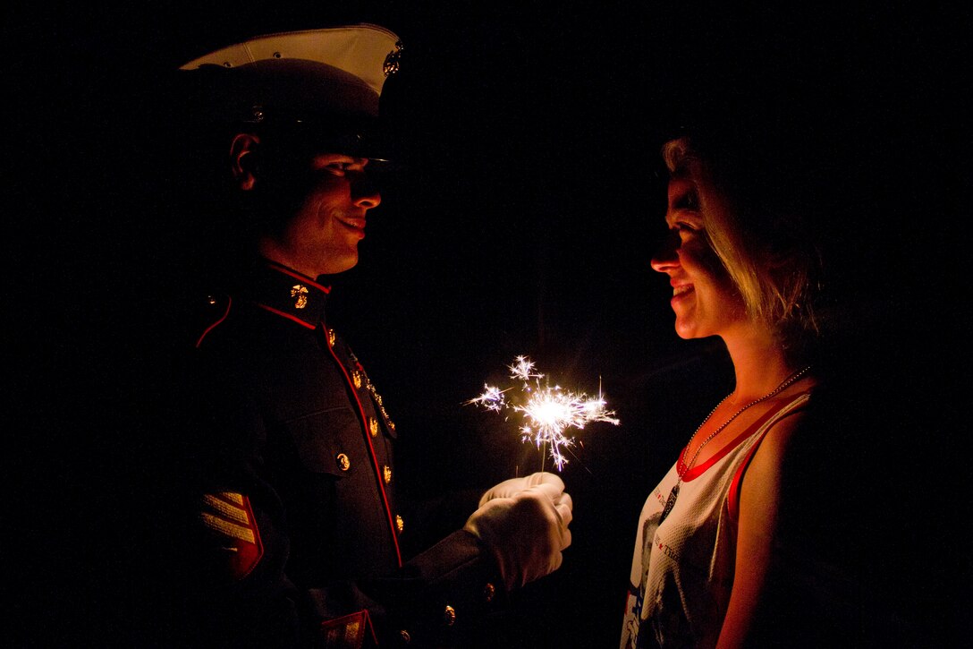 Sgt. Geovanni Cruz, 28, from New Britain, Conn., celebrates Independence Day with his girlfriend Sgt. Aleksandra R. Petropavlovskaya, 26, from Houston, on July 4. Cruz is a motor transportation mechanic and Petropavlovskaya is a supply clerk. Both Marines are attached to Marine Wing Support Squadron 471.