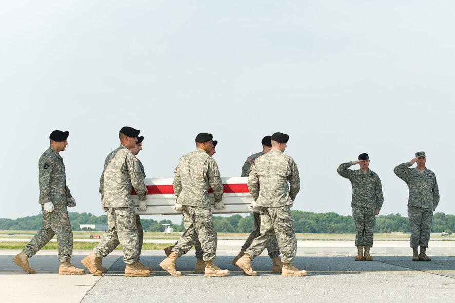 A U.S. Army carry team transfers the remains of Army Staff Sgt. Raul M. Guerra, of Union City, N.J., at Dover Air Force Base, Del., July 5, 2012. Guerra was assigned to the 502nd Military Intelligence Battalion, 201st Military Intelligence Brigade, Fort Lewis, Wash. (U.S. Air Force photo/Roland Balik)