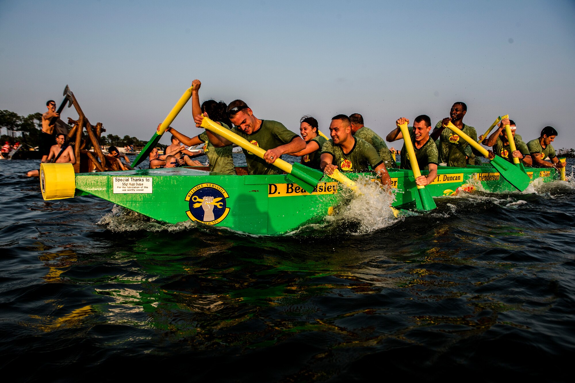 U.S. Air Force airmen from the 1st Special Operations Equipment Maintenance Squadron paddle during the final stretch of the Annual Cardboard Boat Regatta at the marina on Hurlburt Field, Fla., June 29, 2012. The 1st SOEMS team was made up of 12 members, the most members of all 15 entries. (U.S. Air Force photo / Airman 1st Class Christopher Williams) (RELEASED)