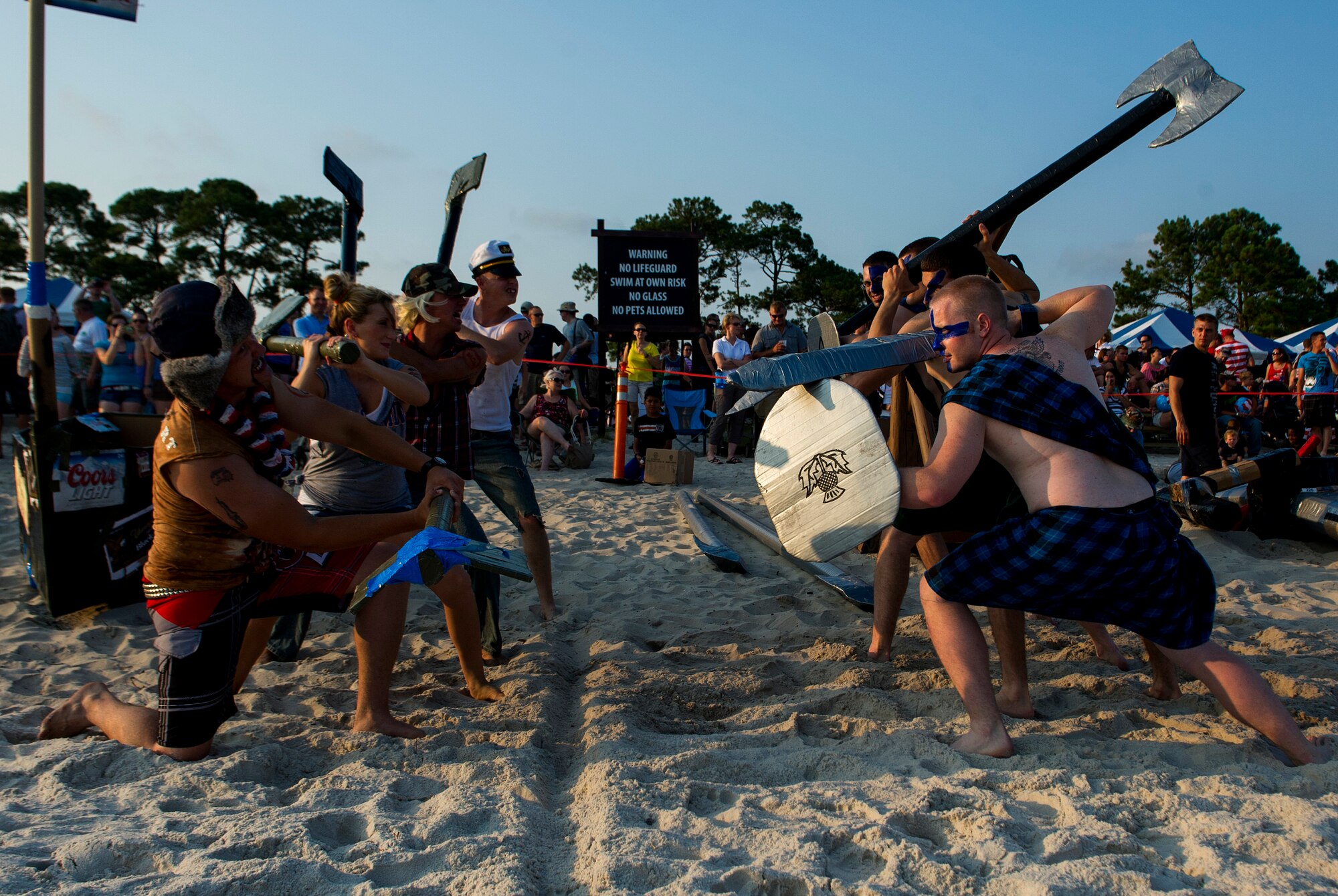 U.S. Air Force airmen face off before the 24th Annual Cardboard Boat Regatta on the sound of Hurlburt Field, Fla., June 29, 2012. Boats and crews lined the shore by the marina, boasting their designs and costumes while waiting for the race to start. (U.S. Air Force photo / Airman 1st Class Christopher Williams) (RELEASED)