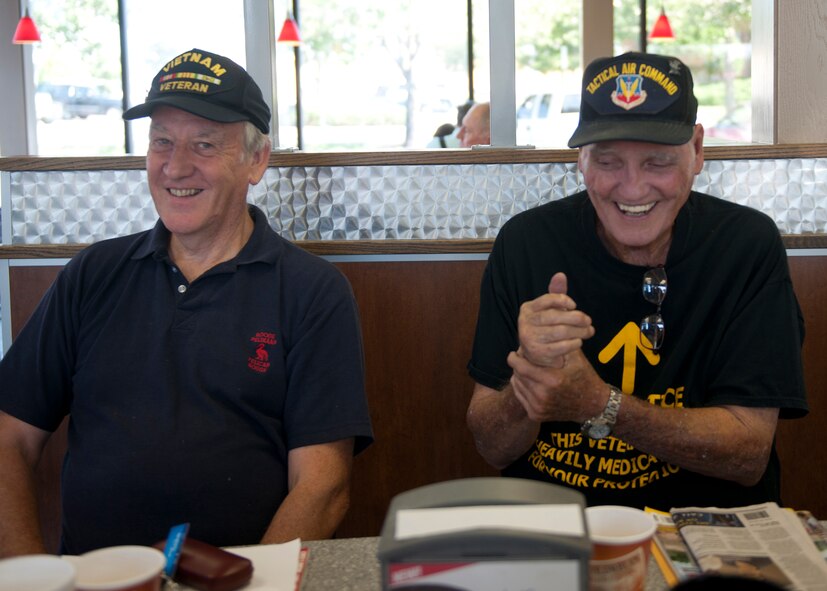 U.S. Air Force Retirees Terence Burton and Carl Hackworth have a laugh while reminiscing at a local restaurant in Valdosta, Ga., June 18, 2012. Burton and Hackworth are two of the many veterans who gather to talk about the ‘old days,’ bicker and joke around with each other. (U.S. Air Force photo by Senior Airman Eileen Meier/Released)