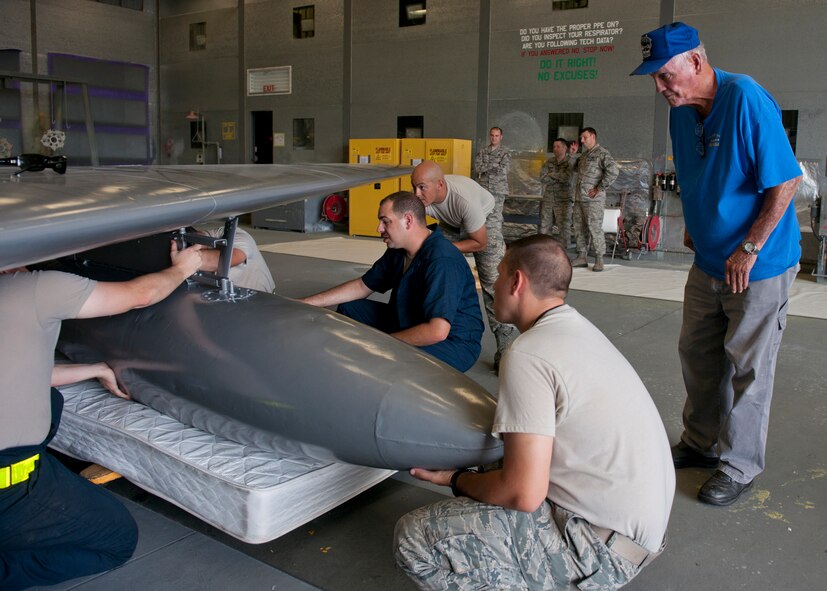 U.S. Air Force retired Master Sgt. Carl Hackworth gets a closer look at the refurbishment of an F-86L Sabre in the fabrication flight hangar June 11, 2012, at Moody Air Force Base, Ga. Hackworth was a former crew chief who worked on the F-86 in the 1950s and re-visited the aircraft since its move from downtown Valdosta April 25, 2012. (U.S. Air Force photo by Senior Airman Eileen Meier/Released)