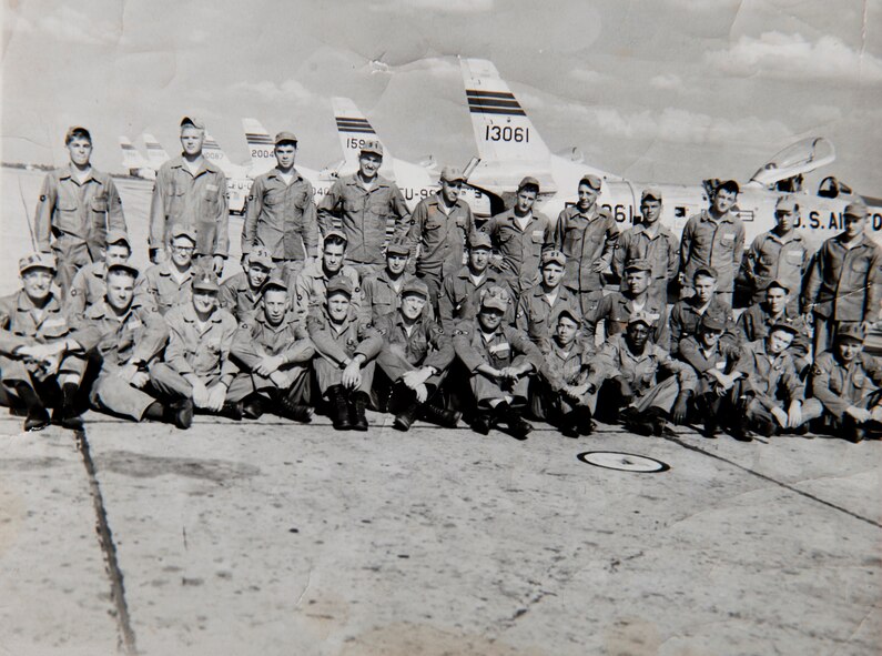 U.S. Air Force retired Master Sgt. Carl Hackworth sits with his F-86 B Flight for a group photo in front of the aircraft they maintain at Hangar 701 in 1957 at Moody Air Force Base, Ga. Hackworth had just been promoted to corporal at the time and ended up retiring at Moody in 1977. (Courtesy photo)