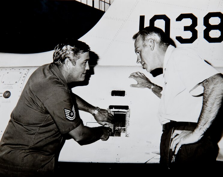 Then U.S. Air Force Tech. Sgt. Carl Hackworth a works on a Northrop T-38 Talon while former Col. Cecil Fox, 3550th Pilot Training Wing deputy commander for operations, talks with him in 1973 at Moody Air Force Base, Ga. Fox was promoted to the grade of major general Aug.1, 1975, and Hackworth went on to retire Aug. 1, 1977. (Courtesy photo)