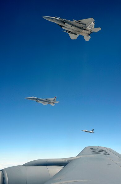 Two F-15s from the 104th Fighter Wing, Westfield, Mass., and an F-16 from the 158th Fighter Wing, Vermont Air National Guard, soar above northern New England  after receiving fuel from the 157th Air Refueling Wing, New Hampshire Air National Guard, June 29. The refueling allowed the F-15s to continue "dog fight" training exercises. (U.S. Air Force photo/SrA. Kelly Galloway)