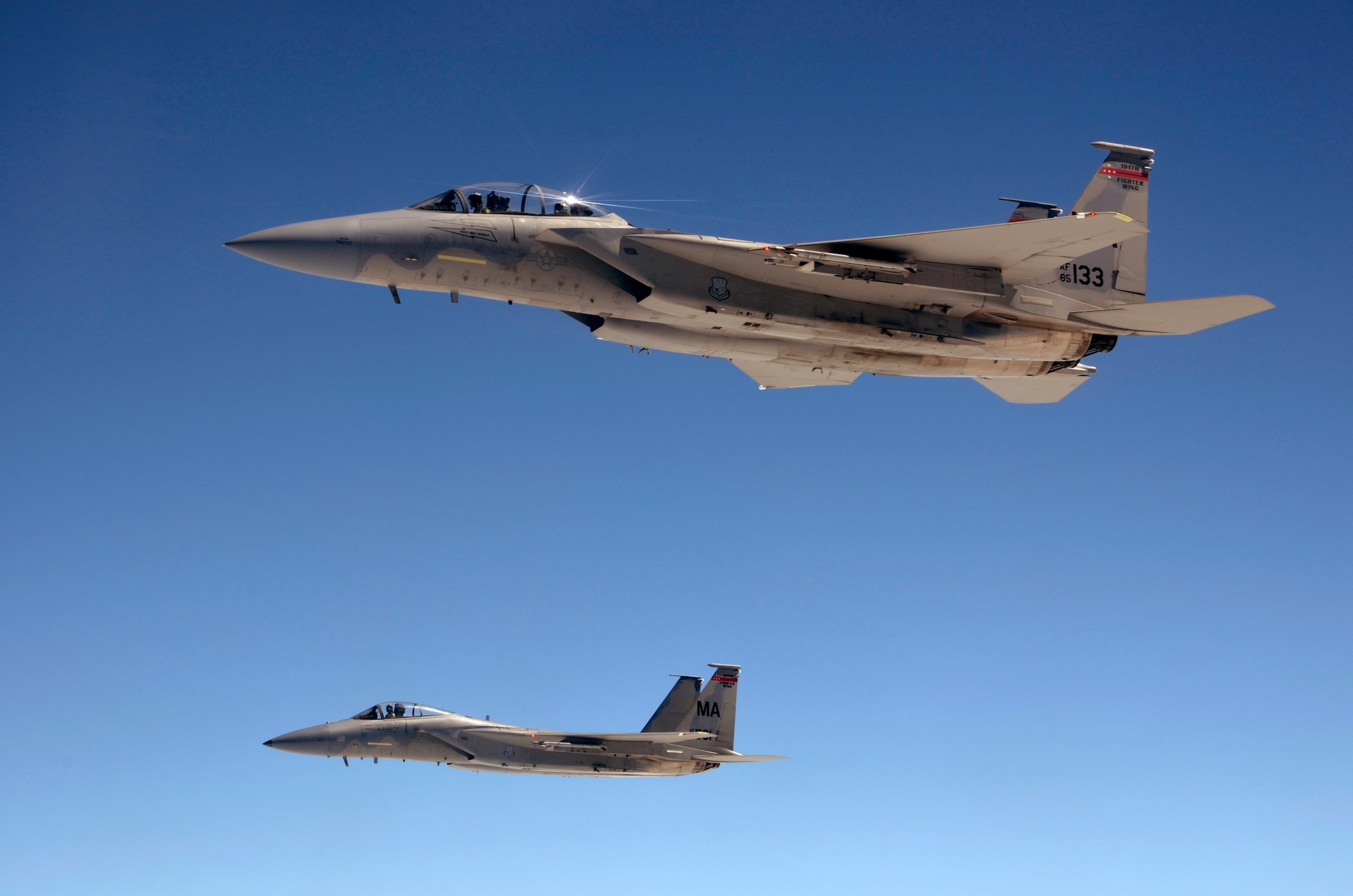 Two F-15s from the 104th Fighter Wing, Westfield, Mass., soar above northern New England  after receiving fuel from the 157th Air Refueling Wing, New Hampshire Air National Guard, June 29. The refueling allowed the F-15s to continue "dog fight" training exercises. (U.S. Air Force photo/SrA. Kelly Galloway)