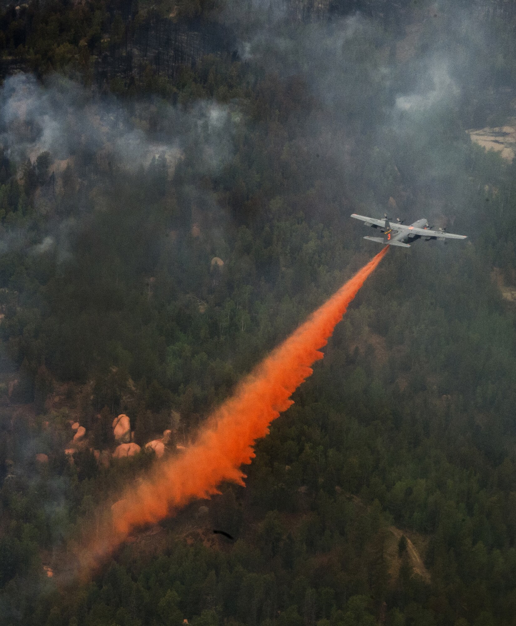A C-130 Hercules equipped with a Modular Airborne Fire Fighting System supports fire suppression efforts near Colorado Springs, Colo., June 27, 2012. Four MAFFS-equipped aircraft, two from the Wyoming Air National Guard’s 153rd Airlift Wing and two from the Air Force Reserve Command's 302nd Airlift Wing, flew in support of the U.S. Forest Service to fight fires in Colorado. (U.S. Air Force photo/Staff Sgt. Stephany D. Richards)
