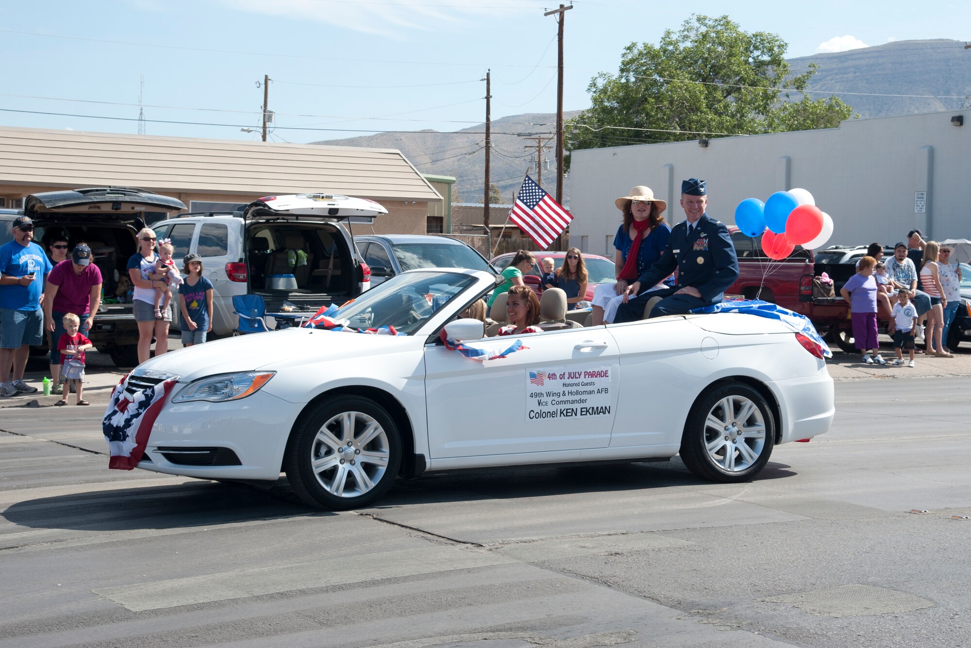 Col. Ken Ekman, 49th Wing vice commander, rides down 10th Street in the Alamogordo, N.M., Independence Day parade, July 4. The parade included participants from the Otero County and Holloman Air Force Base communities, and was in celebration of the adoption of the Declaration of Independence. This was Ekman’s first time participating in the event as the 49th Wing vice commander. (U.S. Air Force photo by Airman 1st Class Anthony M. Ward/Released)