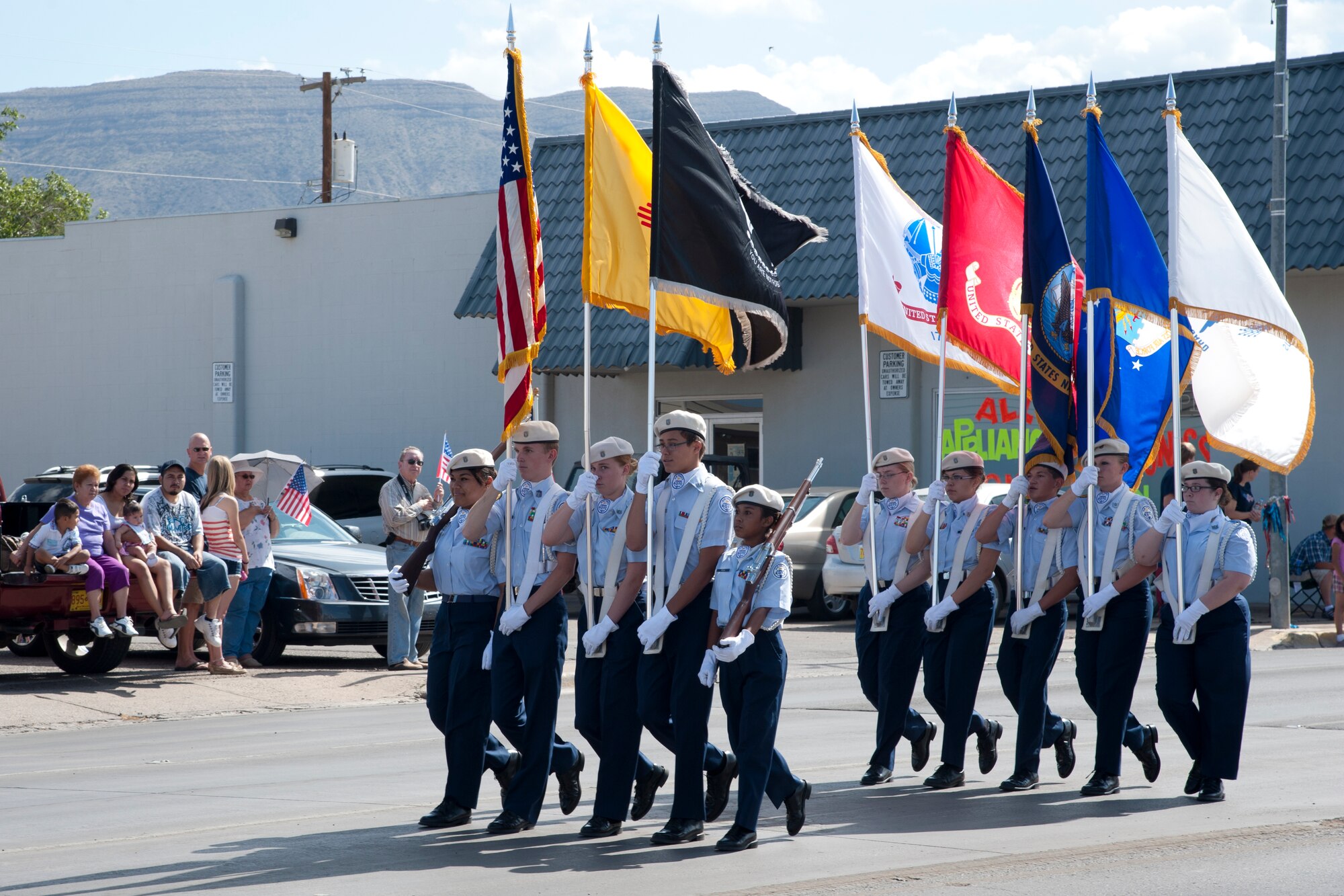 Members of Alamogordo High School’s Junior Reserve Officer Training Corps march down 10th Street during the Alamogordo, N.M., Independence Day parade, July 4. The parade included participants from the Otero County and Holloman Air Force Base communities, and was in celebration of the adoption of the Declaration of Independence, which declared the U.S. an independent nation from Great Britain in 1776. (U.S. Air Force photo by Airman 1st Class Anthony M. Ward/Released)