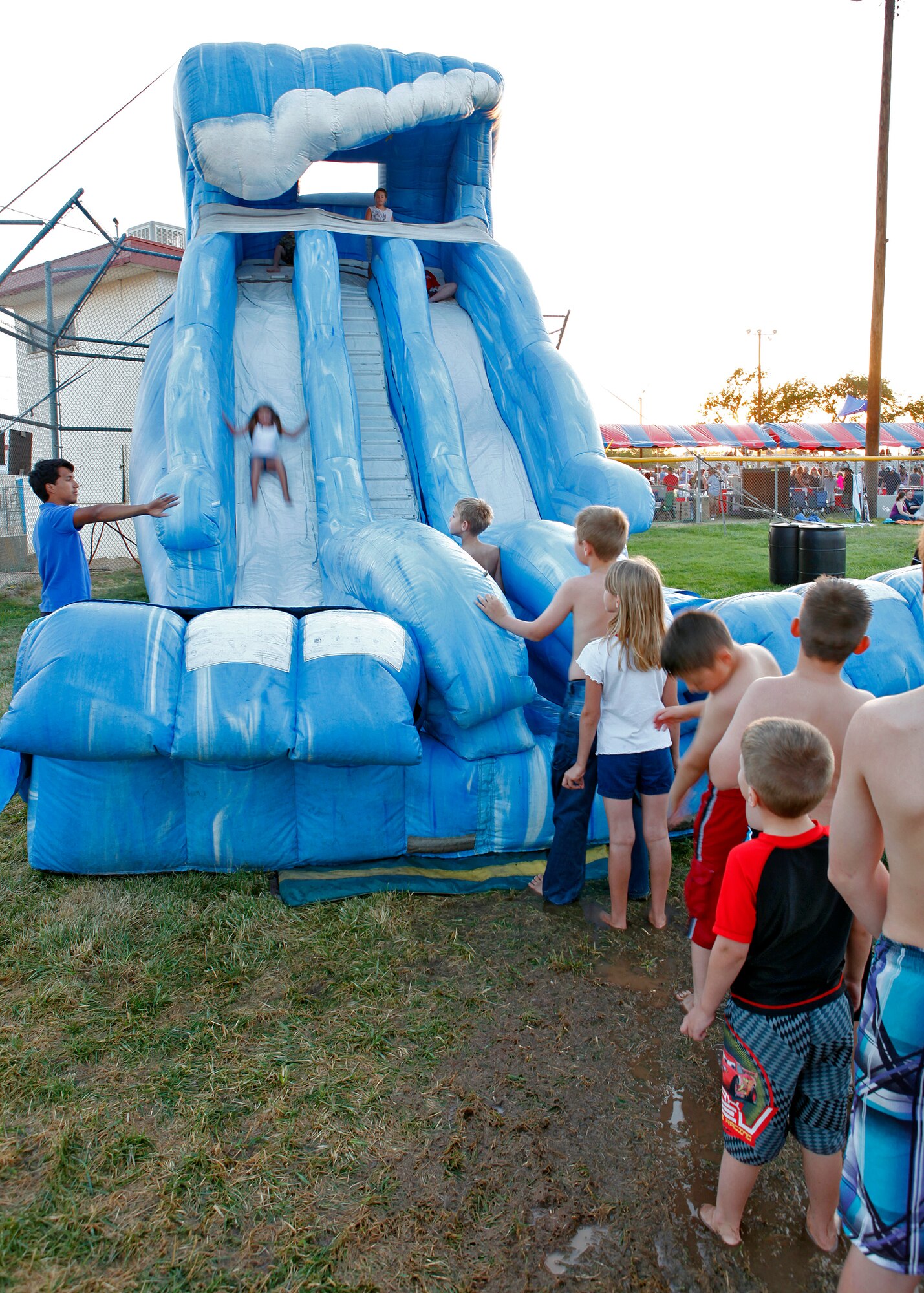 Kids from the base community take part in one of the many inflatable rides that were available for those in attendance during 2012 Summer Bash at Wings and Roberts Field on July 4. (U.S. Air Force photo by Jet Fabara)