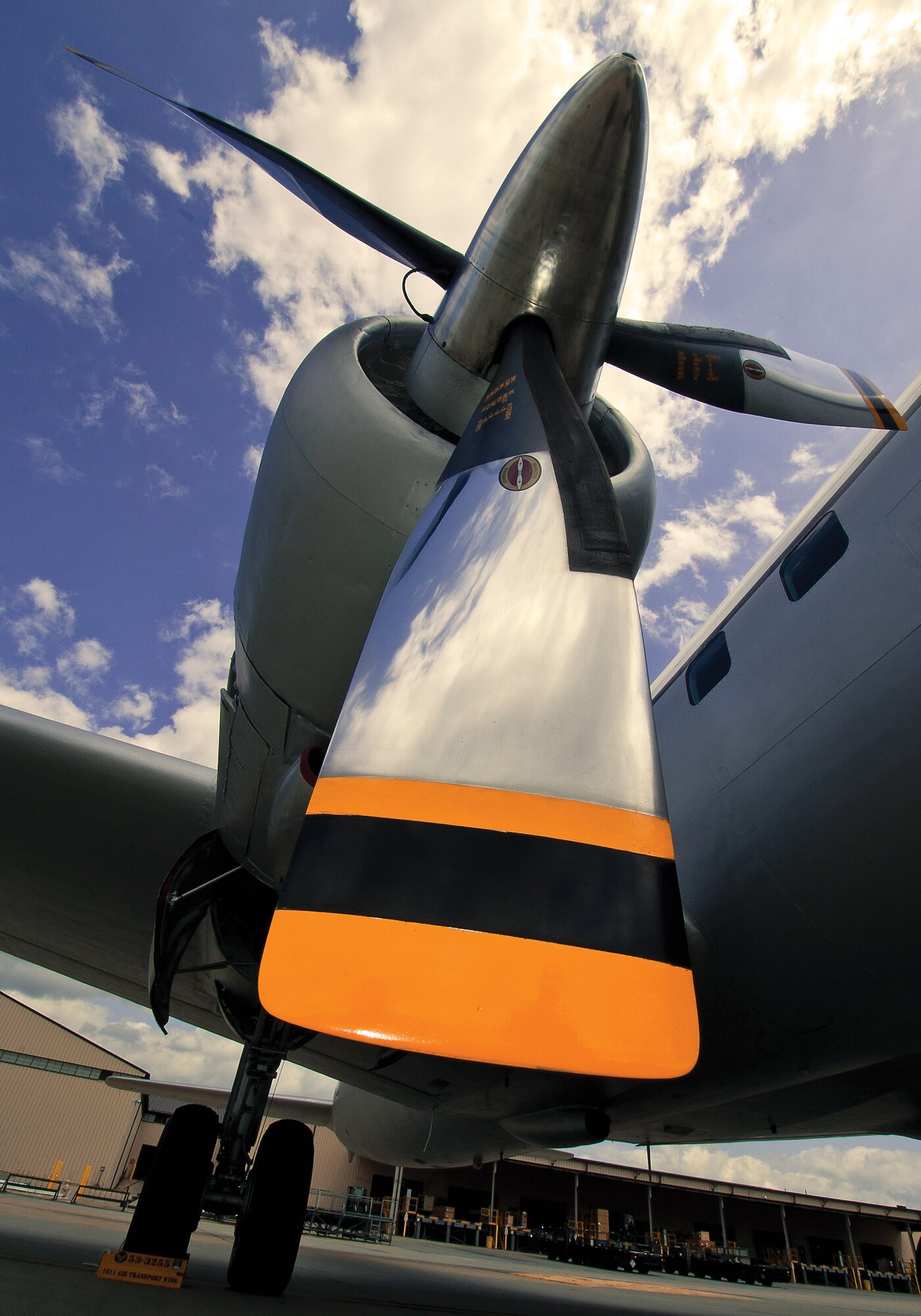 The mirror-like finish of a C-118 Liftmaster reflects the sky on the flightline here. The plane, notable as the aircraft in which Elvis Presley returned after serving in the Army in Europe, is scheduled to return to its place as a static display at the traffic circle near the passenger terminal here later this year. Airmen have been refurbishing the plane since 2009. (U.S. Air Force photo by Shawn J. Jones)