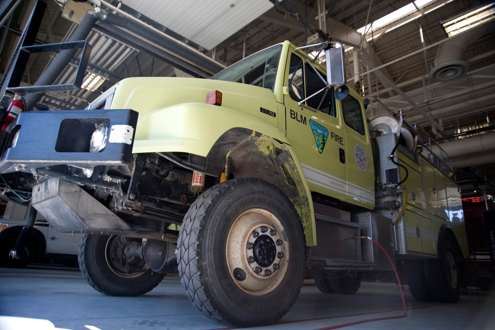 A Type 4 Engine currently on loan from the Idaho Bureau of Land Management, Boise district, is parked inside Fire Station One July 3, 2012, at Mountain Home Air Force Base, Idaho. This type of engine uses low pressure and low volumes of water in order to contain and eliminate blazes unique to the local area. (U.S. Air Force photo/Senior Airman Benjamin Sutton) 