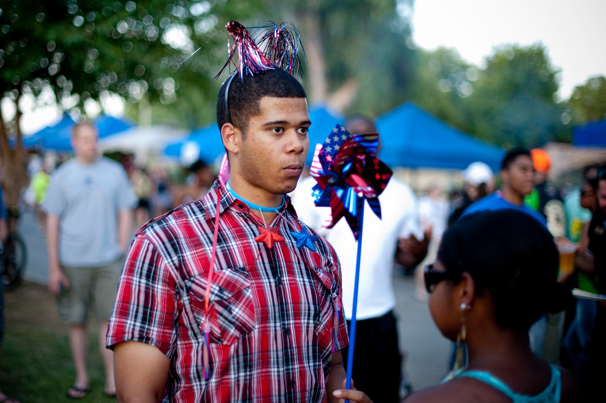 Senior Airman Terence Bow, 39th Comptroller Squadron, celebrates during an Independence Day celebration July 4, 2012, at Arkadas Park on Incirlik Air Base, Turkey. Activities included competitions, food and live entertainment. (U.S. Air Force photo by Senior Airman William A. O'Brien/Released) 