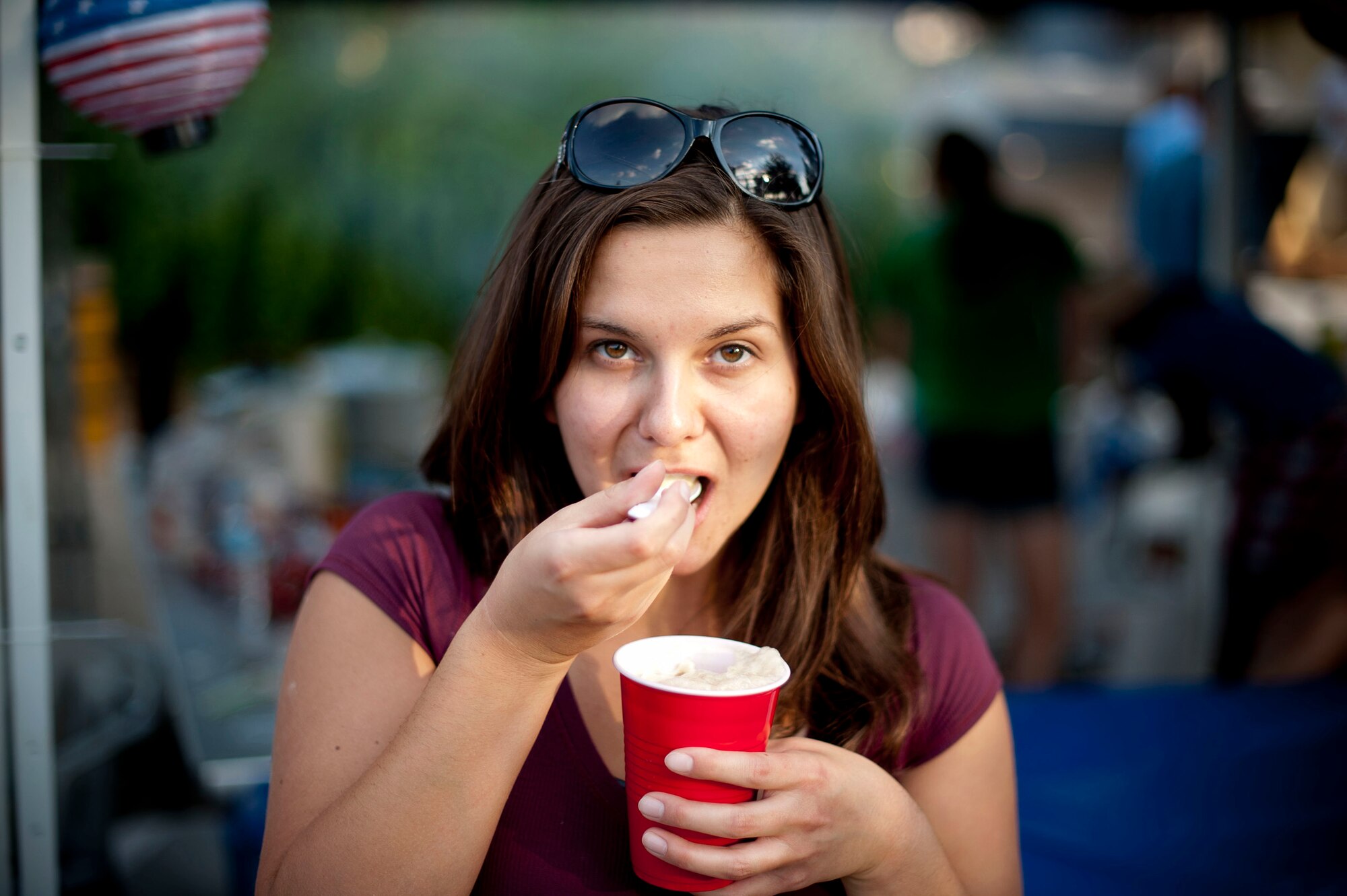 Airman 1st Class Megan Davidson, 39th Contracting Squadron, eats a root beer float during Independence Day celebrations July 4, 2012, at Arkadas Park on Incirlik Air Base, Turkey. The event offered Team Incirlik an opportunity to celebrate Independence Day despite being away from America. (U.S. Air Force photo by Senior Airman William A. O'Brien/released) 