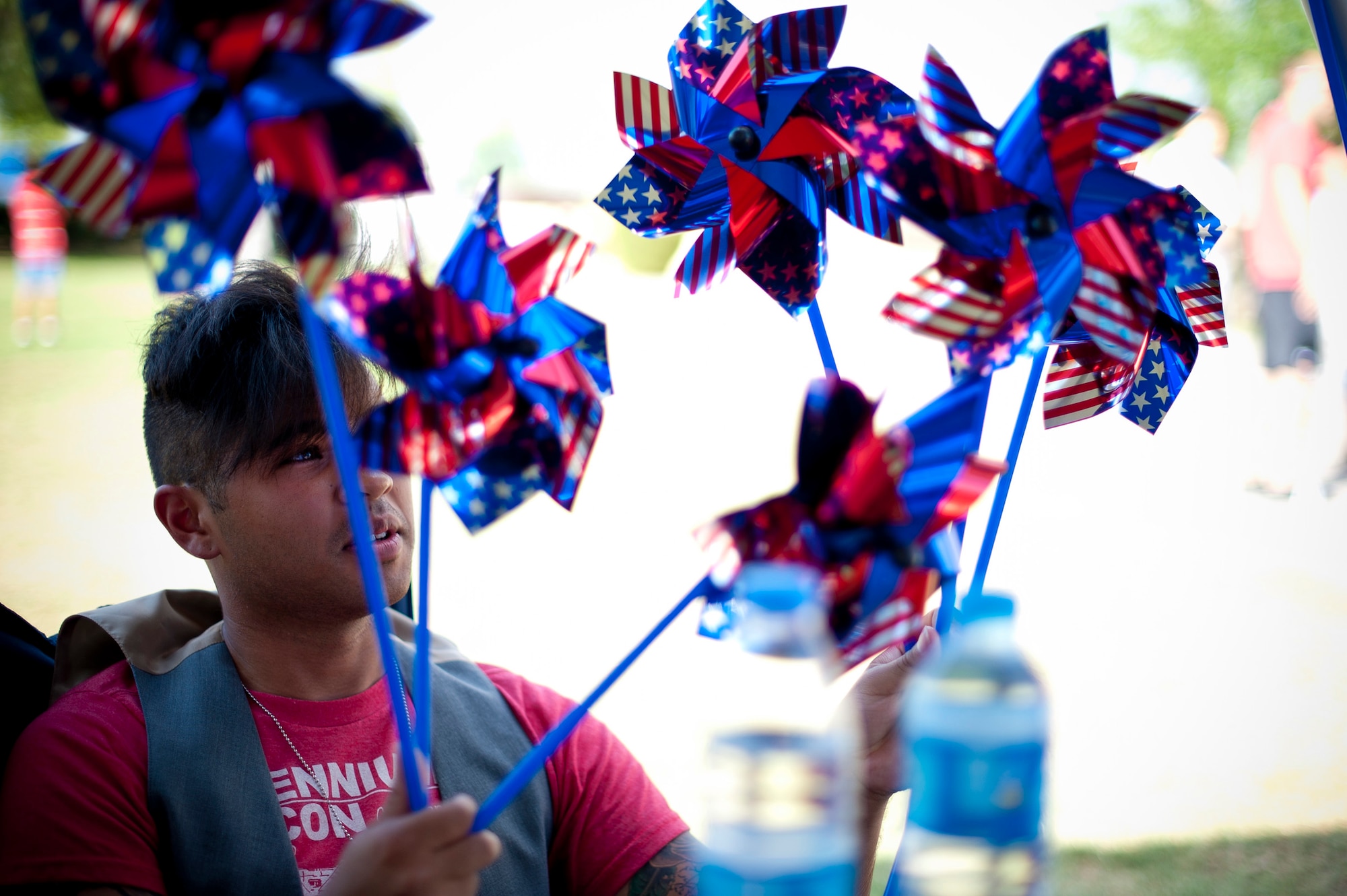 Senior Airman Christopher Greevebiester, 39th Maintenance Squadron, plays with pinwheels July 4, 2012, at Arkadas Park, Incirlik Air Base, Turkey. Team Incirlik celebrated Independence Day with various activities, food and live entertainment. (U.S. Air Force photo by Senior Airman William A. O'Brien/released)