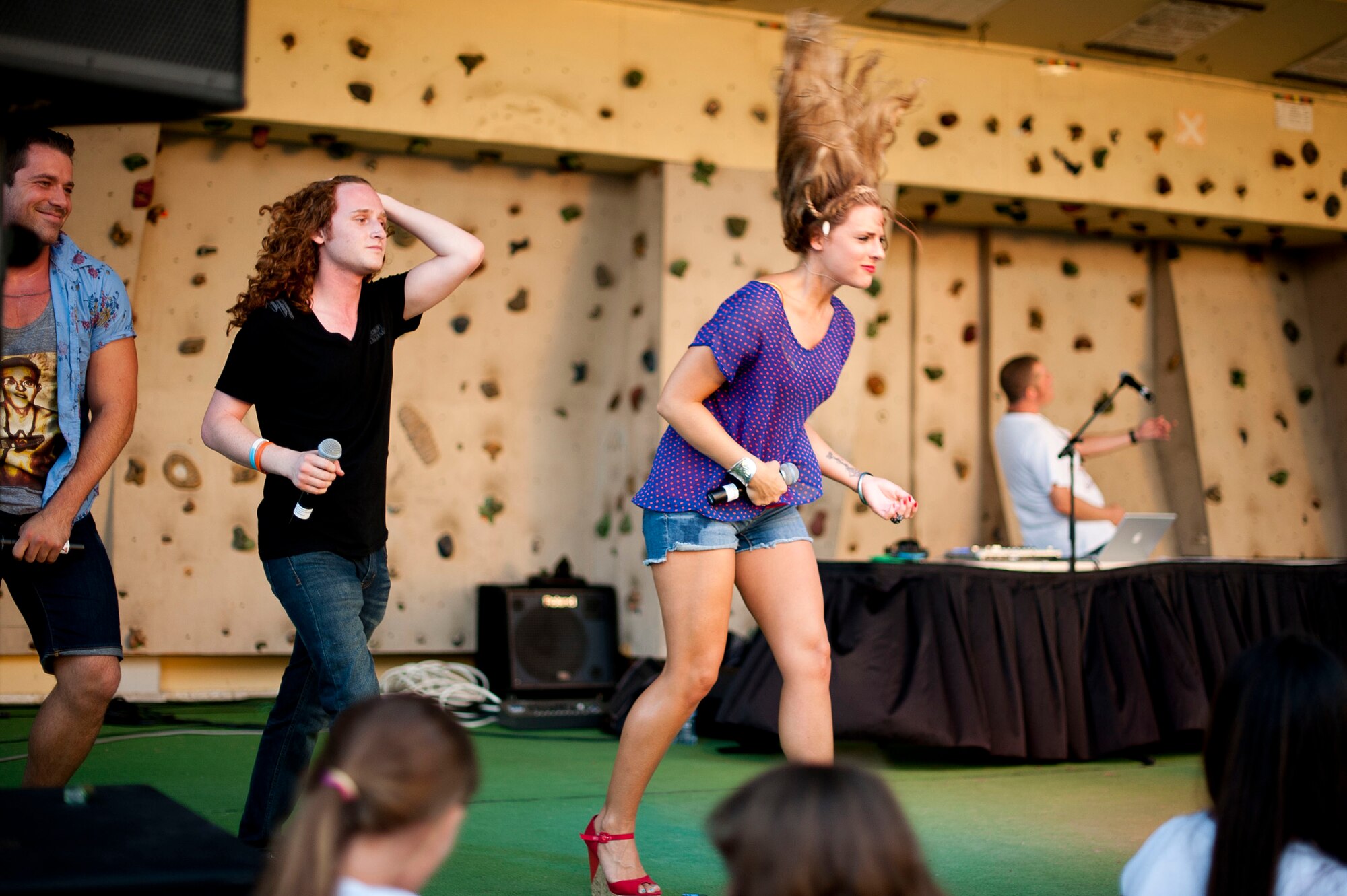 American Idol contestants dance on stage during an Independence Day celebration July 4, 2012, at Arkadas Park on Incirlik Air Base, Turkey. The performance included covers of several current and classic songs. (U.S. Air Force photo by Senior Airman William A. O'Brien/released)