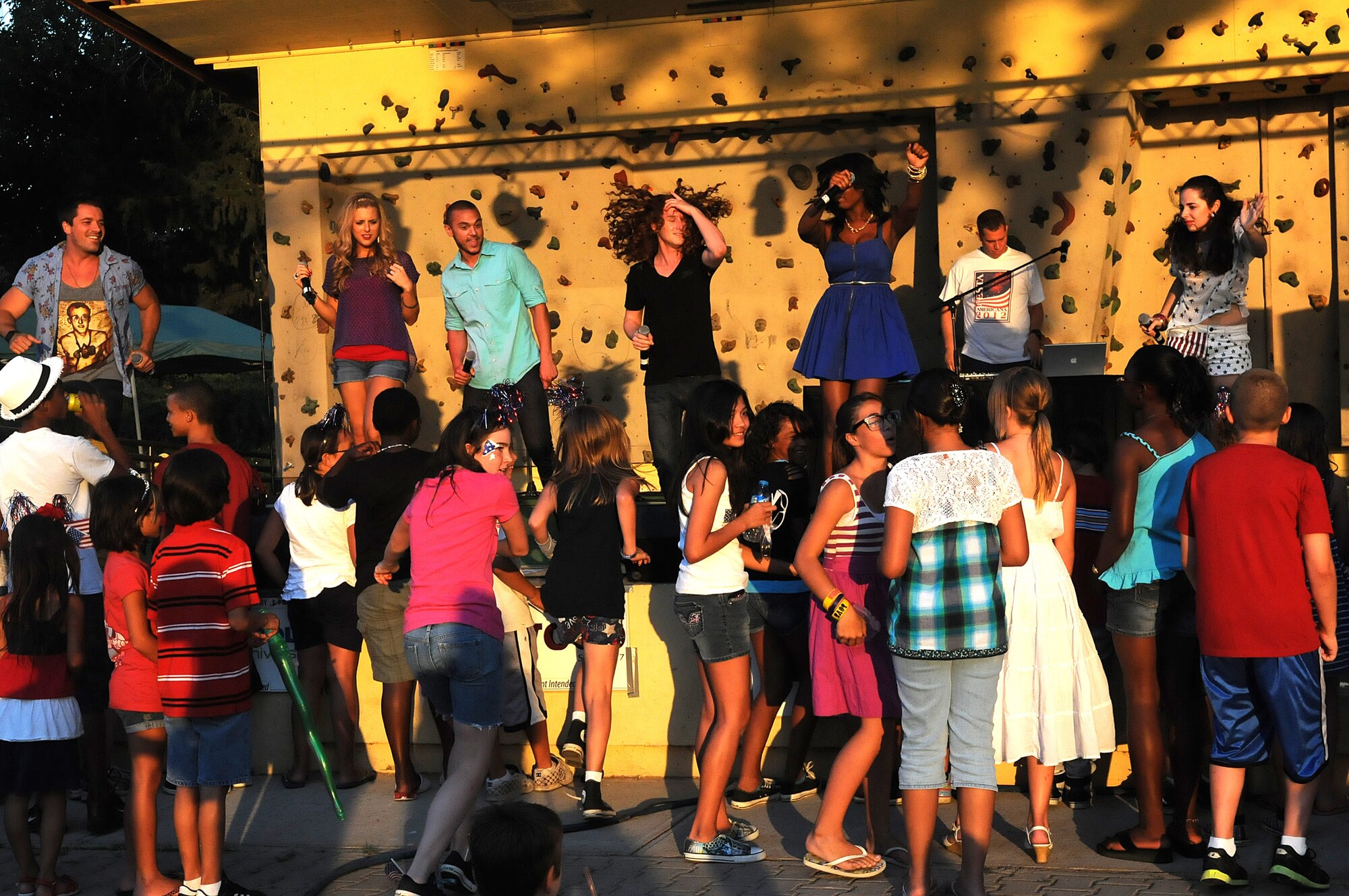 Members of the American Idol Tour perform during the Independence Day celebration July 4, 2012, at Incirlik Air Base, Turkey. The singers signed autographs and performed several songs for attendees of the event. The visit  was sponsored by Armed Forces Entertainment. (U.S. Air Force photo by Senior Airman Marissa Tucker/Released)