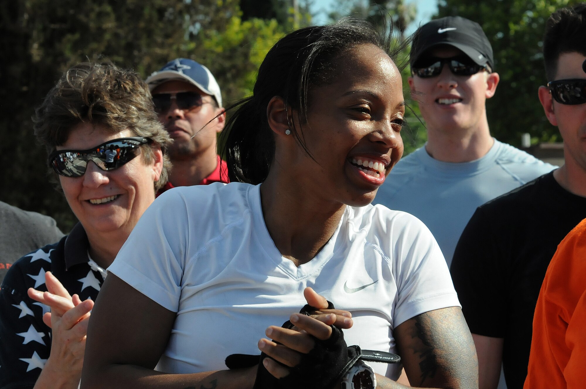 Sharon Clarke, wife of Julian Clarke from the 39th Contracting Squadron, cheers for her husband during the Strongman Competition July 4, 2012, at Incirlik Air Base, Turkey. Both husband and wife took first place in the competition for the male and female categories, respectively. (U.S. Air Force photo by Senior Airman Marissa Tucker/Released)
