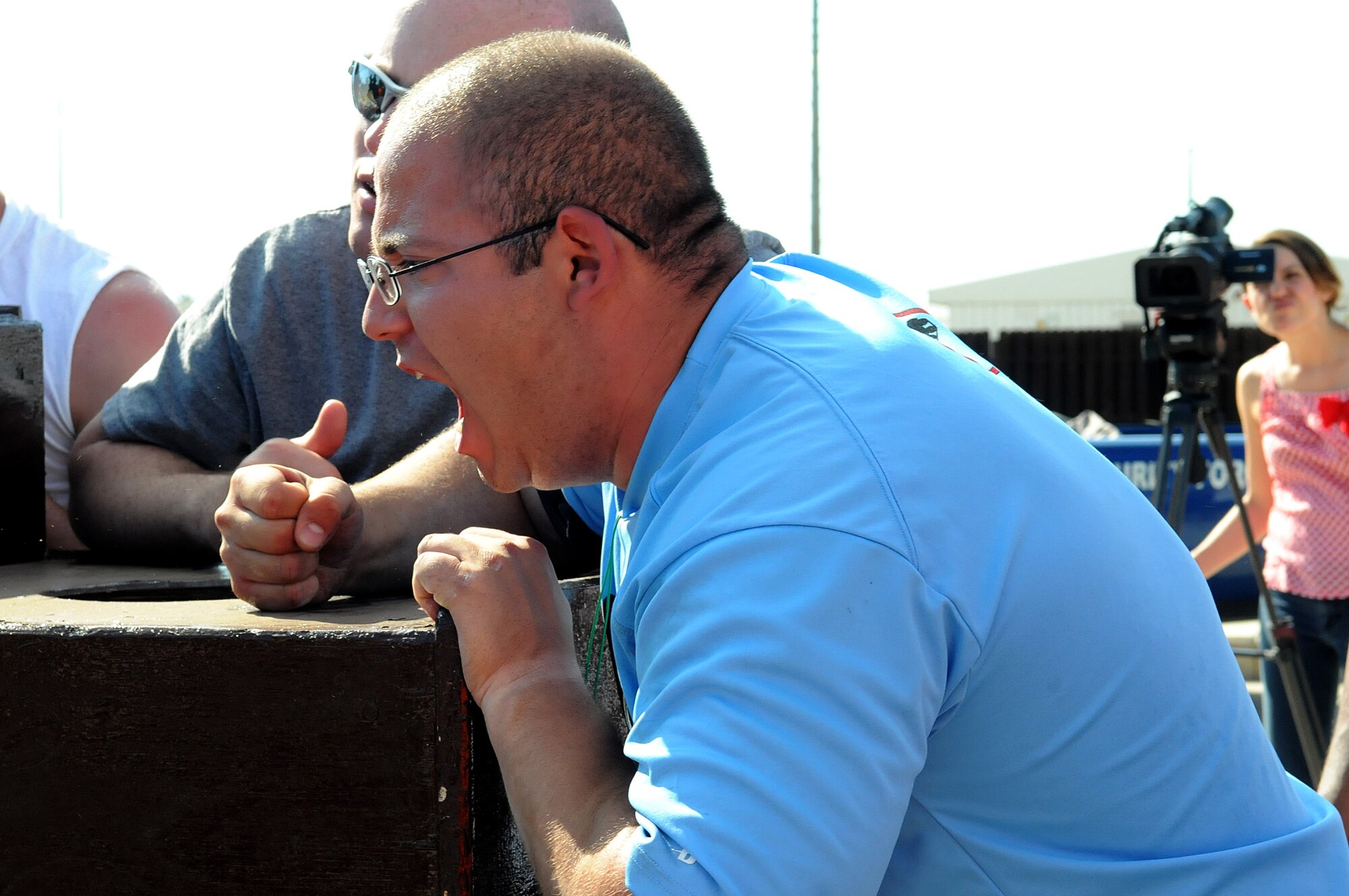 A member of the U.S. Army cheers for a participant during the Strongman Competition July 4, 2012, at Incirlik Air Base, Turkey. The competition was part of the Independence Day activities sponsored by the 39th Force Support Squadron and was followed by a concert and fireworks. Members of the U.S. Army who are temporarily stationed at Incirlik participated in the events to build camaraderie on the holiday.  (U.S. Air Force photo by Senior Airman Marissa Tucker/Released)
