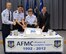 Gen. Janet Wolfenbarger, commander of Air Force Materiel Command, prepares to cut a cake to commemorate the 20th anniversary of AFMC. The brief ceremony marking the occasion took place in Headquarters AFMC July 2, 2012. The command's 20th birthday was July 1. Assisting the general are (from left) Command Chief Master Sgt. Michael Warner, Lt. Gen. C.D. Moore II, AFMC vice commander, and Dr. Steve Butler, AFMC executive director. (U.S. Air Force photo/Ron Fry)
