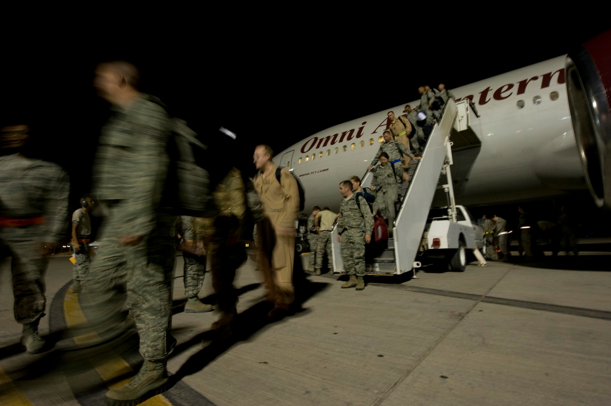 A new crop of service members have arrived for their deployment July 5, 2012 to Southwest Asia and the first people they will meet are members of the 379th Expeditionary Force Support Squadron Personnel Support Contingency Operations team. PERSCO accounts for 100 percent of people that come through here, regardless of their length of stay and ensures a smooth transition through immigrations and customs. (U.S Air Force photo/Staff Sgt. Sheila deVera)