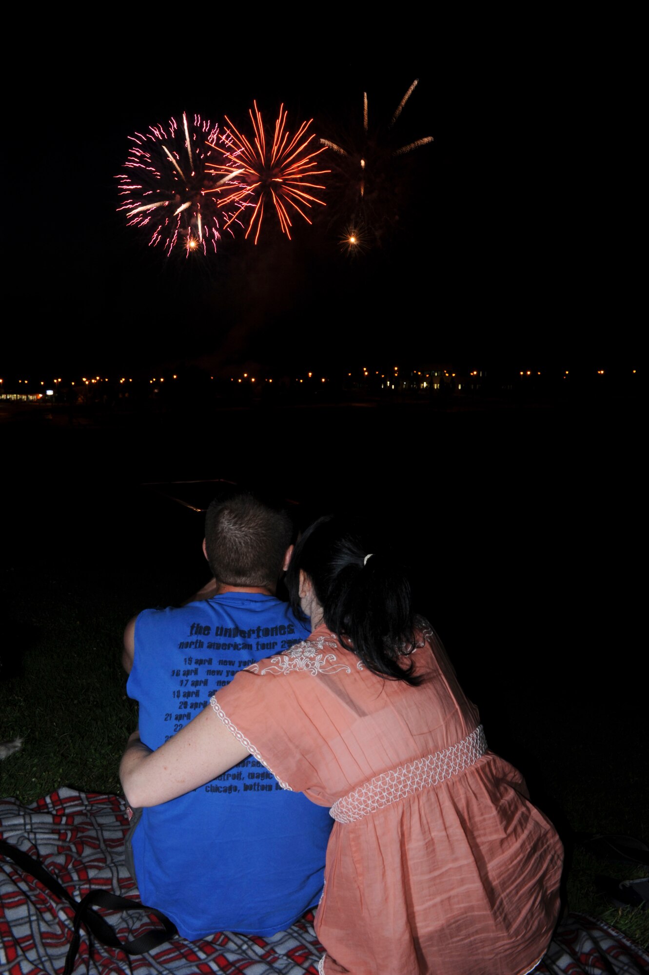 SPANGDAHLEM AIR BASE, Germany – Senior Airman Willis Jensen, 52nd Component Maintenance Squadron, and his wife, Kat, enjoy the fireworks display during Super Saber Appreciation Day July 4 here. The 52nd Force Support Squadron holds this event for Airmen and their families to celebrate Independence Day and show appreciation to the 52nd Fighter Wing community. (U.S. Air Force photo by Senior Airman Natasha Stannard)