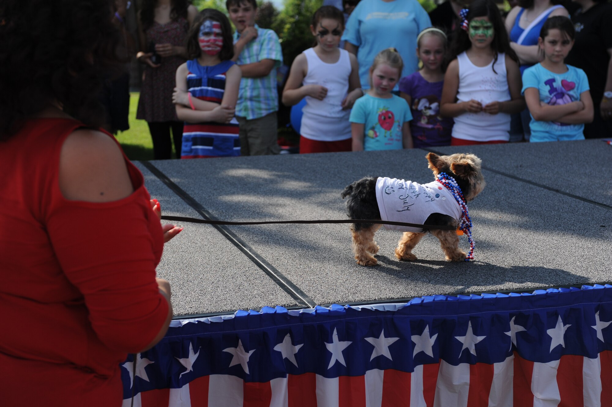 SPANGDAHLEM AIR BASE, Germany – A participant shows off her patriotic pet’s talents during Super Saber Appreciation Day July 4 here. The dog show was one of the many free activities put on by the 52nd Force Support Squadron to celebrate Independence Day and show appreciation to the 52nd Fighter Wing community. (U.S. Air Force photo by Senior Airman Natasha Stannard/Released)