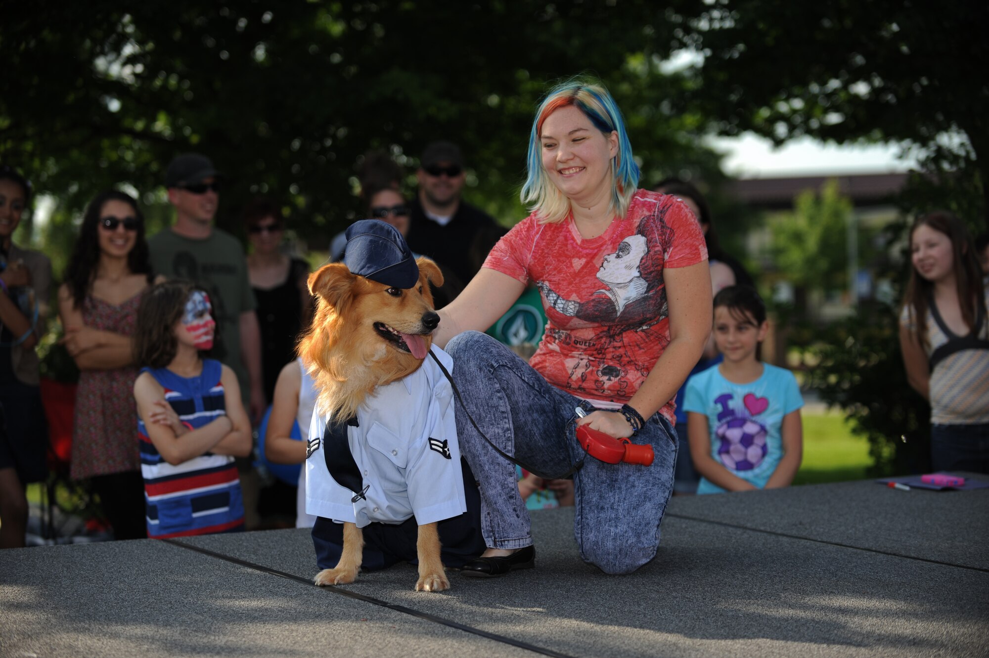 SPANGDAHLEM AIR BASE, Germany – Megan Appleby, wife of Staff Sgt. John Appleby, showcases her dog, Ty, at the pet show during Super Saber Appreciation Day here July 4. The event included a number of activities including pony rides, a carousel and swings, and two bouncy castles were available for younger children. The 52nd Force Support Squadron sponsored the event to celebrate Independence Day and show appreciation to the 52nd Fighter Wing community. (U.S. Air Force photo by Senior Airman Matthew B. Fredericks/Released)