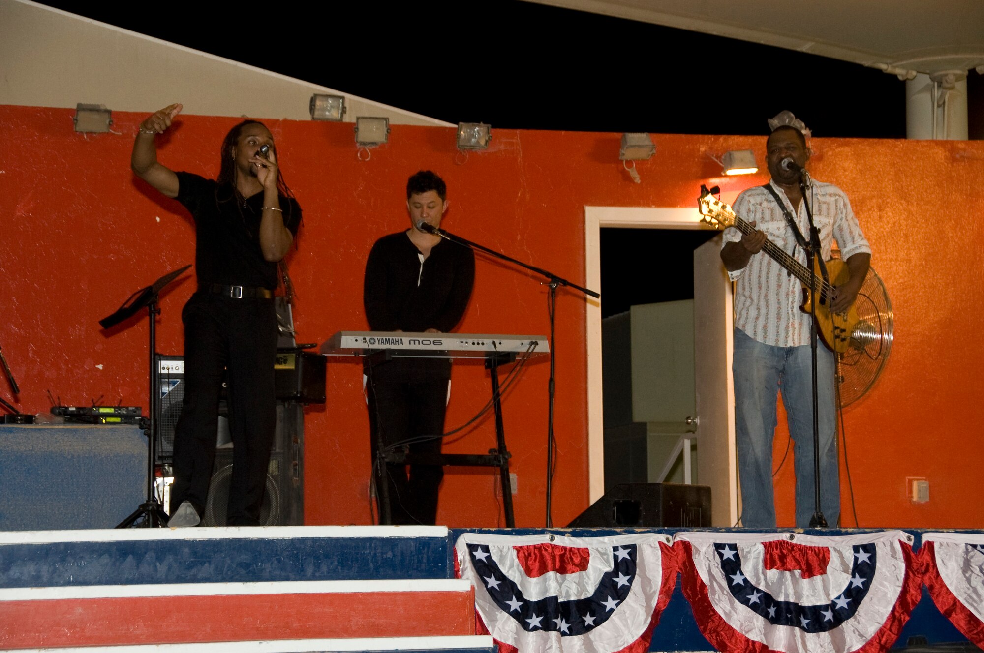 Soul Café, an R&B cover band, performed for a packed house at Memorial Plaza in celebration of the July 4th celebration in Southwest Asia. The Independence Day’s festivities also included a 5K run, steak grilling, stand-up comedians and a Biggest Splash Contest. (U.S. Air Force photo/Senior Airman Bryan Swink)