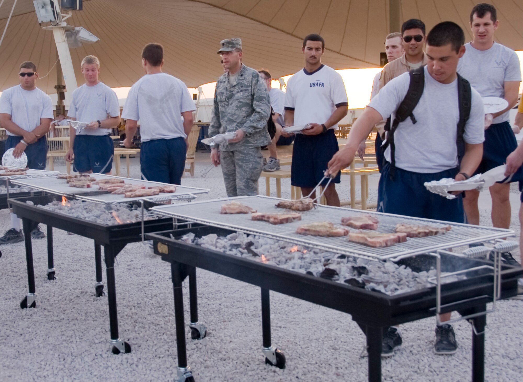 Have ‘em your way. Service members stationed in Southwest Asia were treated to T-bone steaks during the installations 4th of July celebration. Comedian’s Daran Howard and Nema Williams performed along with Soul Café, an R&B cover band. (U.S. Air Force photo/Senior Airman Bryan Swink)