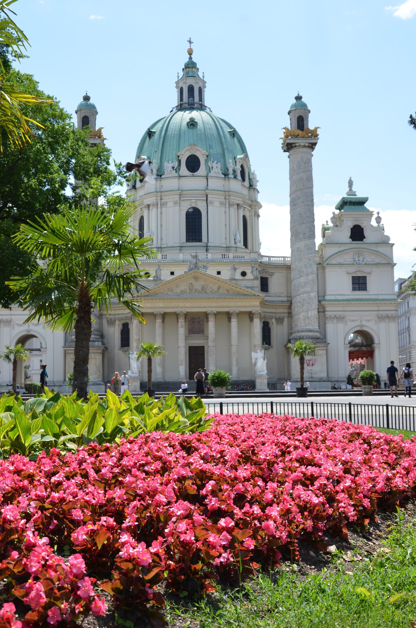 Tourists explore the grounds surrounding Saint Charles's Church.  The church is one of many picturesque sites visitors can visit along a walking tour of Vienna.  (U.S. Air Force photo/Capt. Erick Saks)