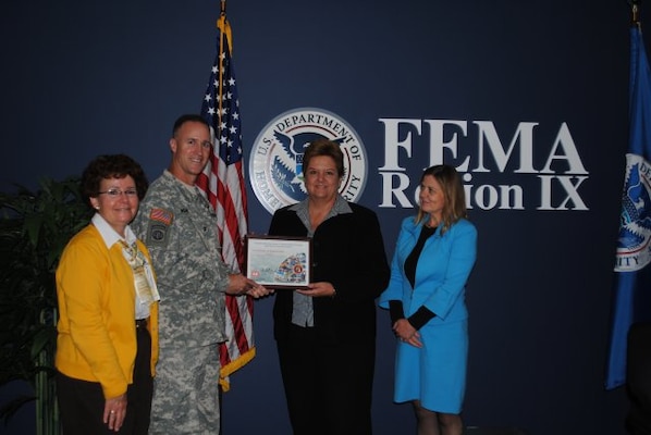 FEMA Region IX Administrator Nancy Award accepted a Certificate of Appreciation from Col. Wehr. He presented the certificate as a token of the Corps' regard and thanks for the FEMA team's collaboration with the Corps on floodplain management, mapping, risk analysis, and hazard mitigation, especially for California's Central Valley. He said FEMA Mitigation Division Director Sally Ziolkowski (left) and Kathy Schaefer (right), Chief of the Hazard Mitigation Assistance Branch and thier teams have been key to progress. 

