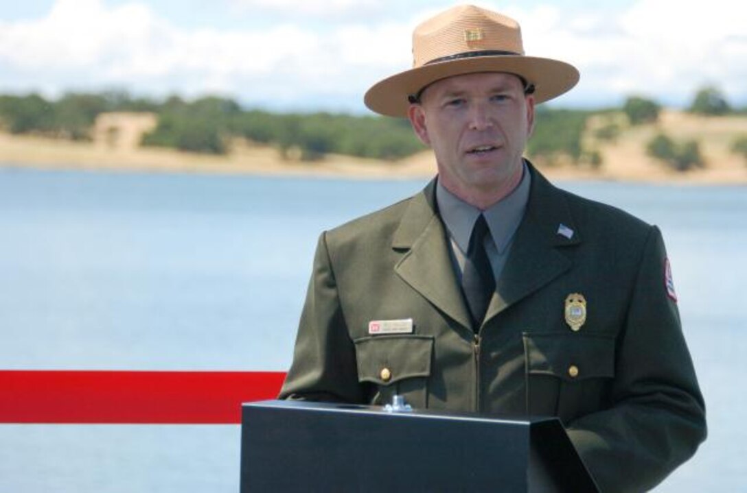 U.S. Army Corps of Engineers senior park ranger Bill Miller welcomes guests at a ribbon-cutting ceremony for a new boat ramp at Black Butte Lake, Calif., May 18, 2011. An expansion project funded by a grant from the California Department of Boating and Waterways.