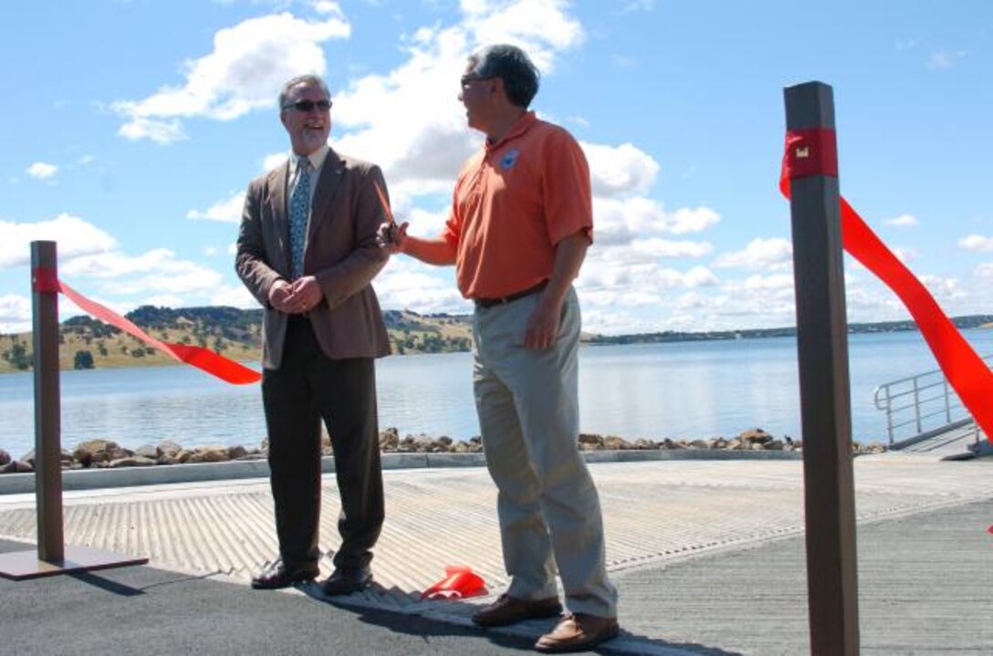 U.S. Army Corps of Engineers Sacramento District construction operations division chief Mike Mahoney (left) and California Department of Boating and Waterways boating facilities division chief Steve Watanabe officially open a new boat ramp at Black Butte Lake in California.