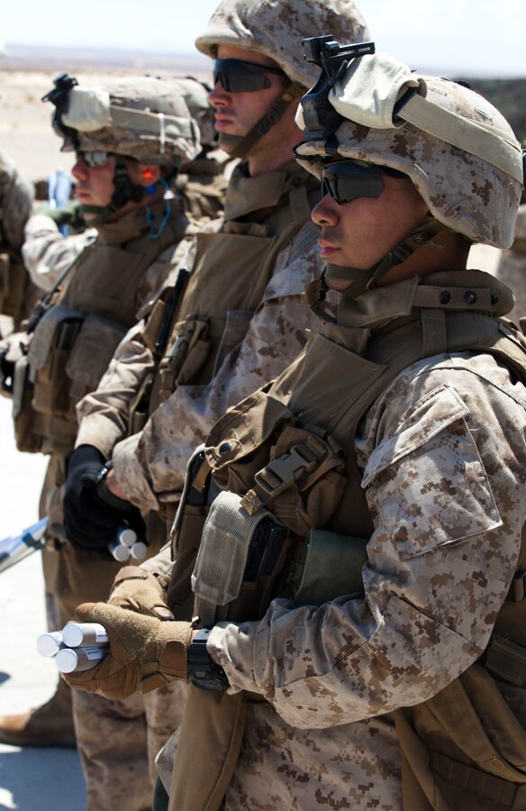 Marines from Weapons Company, 2nd Battalion, 25th Marine Regiment, stand by prior to firing practice Light Anti-Armor Weapon rounds on Range 109. Javelin Thrust is an annual large-scale exercise here which allows active and reserve Marines and sailors from 38 different states to train together as a seamless Marine Air Ground Task Force.