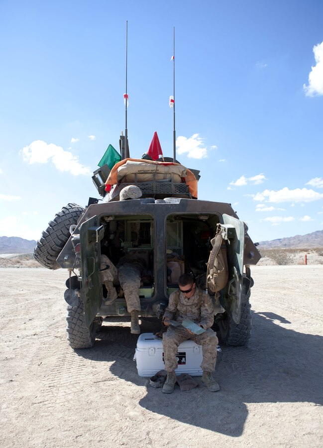 4th Light Armored Reconnaisance Marines rest and eat chow between conducting assault drills at Range 500A. Javelin Thrust is an annual large-scale exercise here which allows active and reserve Marines and sailors from 38 different states to train together as a seamless Marine Air Ground Task Force.
