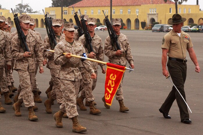 Gunnery Sgt. Jeffrey E. Liske, senior drill instructor, Platoon 3273, Company M, 3rd Recruit Training Battalion marches his platoon performing a drill movement known as eyes right during a final drill competition aboard Marine Corps Recruit Depot San Diego June 18. Eyes right is performed when passing the reviewing officer during drill.