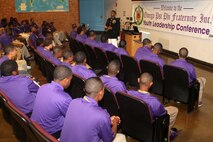 Recruiting Station Dallas Commanding Officer Maj. Karl Tinson answers questions from members of the Omega Psi Phi Fraternity during their annual Youth Leadership Conference July 6. Tinson, an Albany, Ga., native, also discussed Marine Corps leadership principles during the event.