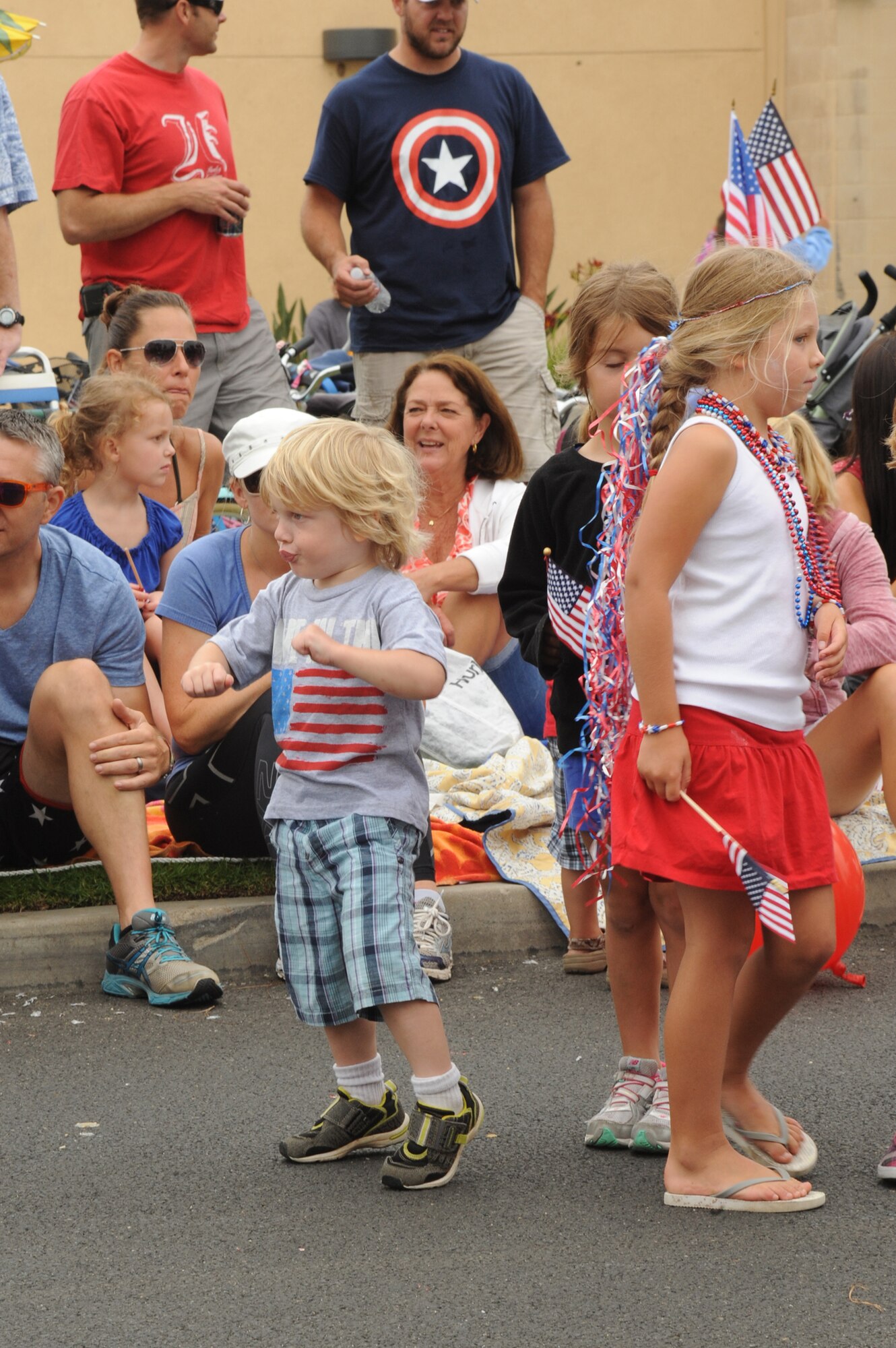 Kids get into the holiday spirit during the Huntington Beach 4th of July parade. Approximately 300,000 people attended this year’s parade. Lieutenant Gen. Ellen Pawlikowski, SMC commander, was the parade’s military grand marshal.  (Photo by Sarah Corrice)
