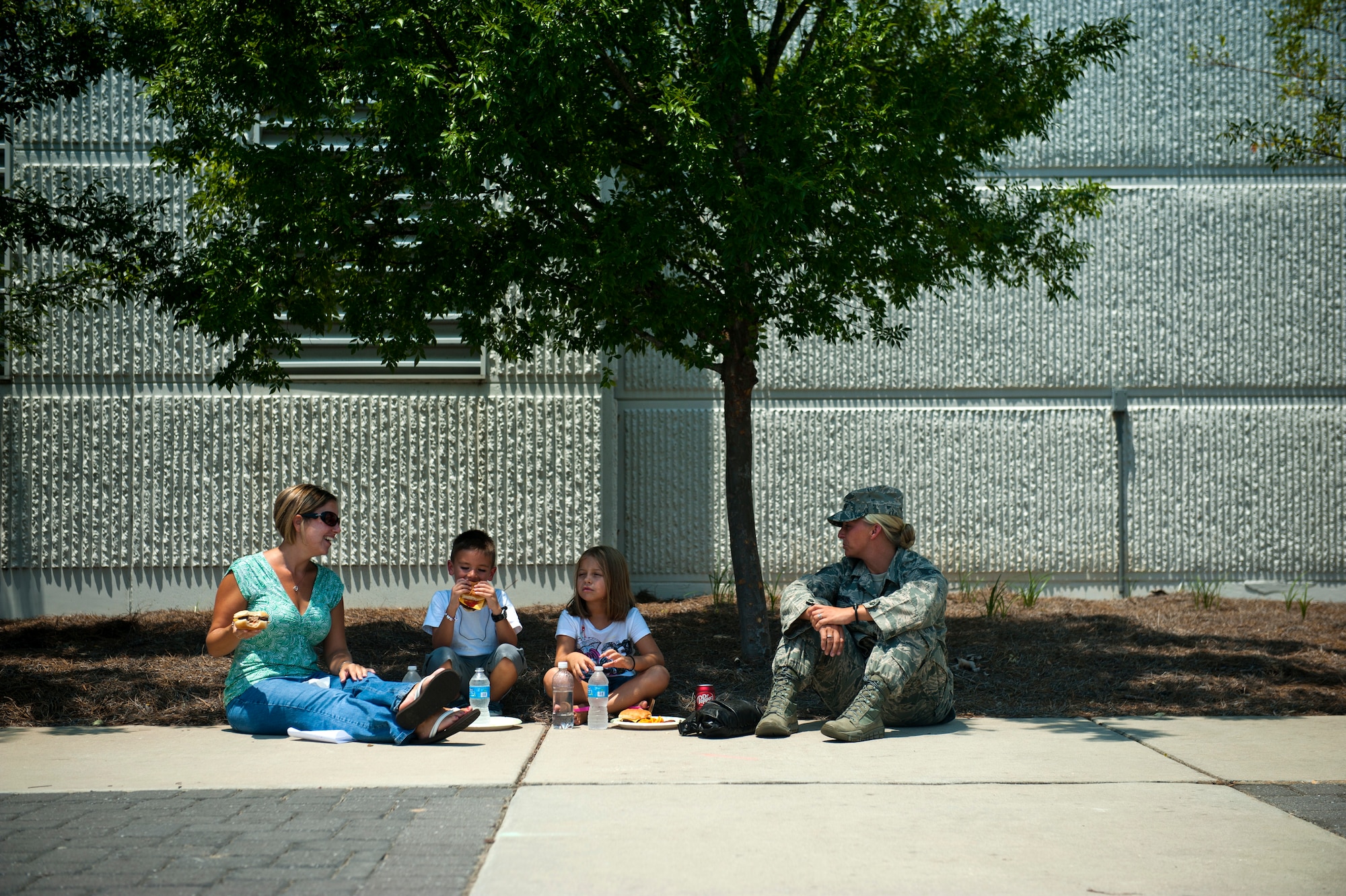 From left, Christine Martinez, Air Force Special Operations Command personnel office, and her son, Jason, 5, enjoy lunch with Kirsten Morris, 6, and her mom Tech. Sgt. Rebekah Morris, AFSOC personnel office, June 29, 2012, at Hurlburt Field. AFSOC hosted Bring Your Child to Work Day. (U.S. Air Force photo by Staff Sgt. David Salanitri) 