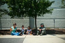 From left, Christine Martinez, Air Force Special Operations Command personnel office, and her son, Jason, 5, enjoy lunch with Kirsten Morris, 6, and her mom Tech. Sgt. Rebekah Morris, AFSOC personnel office, June 29, 2012, at Hurlburt Field. AFSOC hosted Bring Your Child to Work Day. (U.S. Air Force photo by Staff Sgt. David Salanitri) 