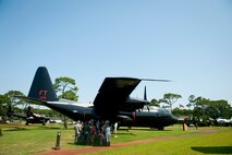 Airmen and family from Air Force Special Operations Command get a history lesson at the Air Park at Hurlburt Field, Fla, June 29, 2012. AFSOC hosted Bring Your Child to Work Day. (U.S. Air Force photo by Staff Sgt. David Salanitri) 