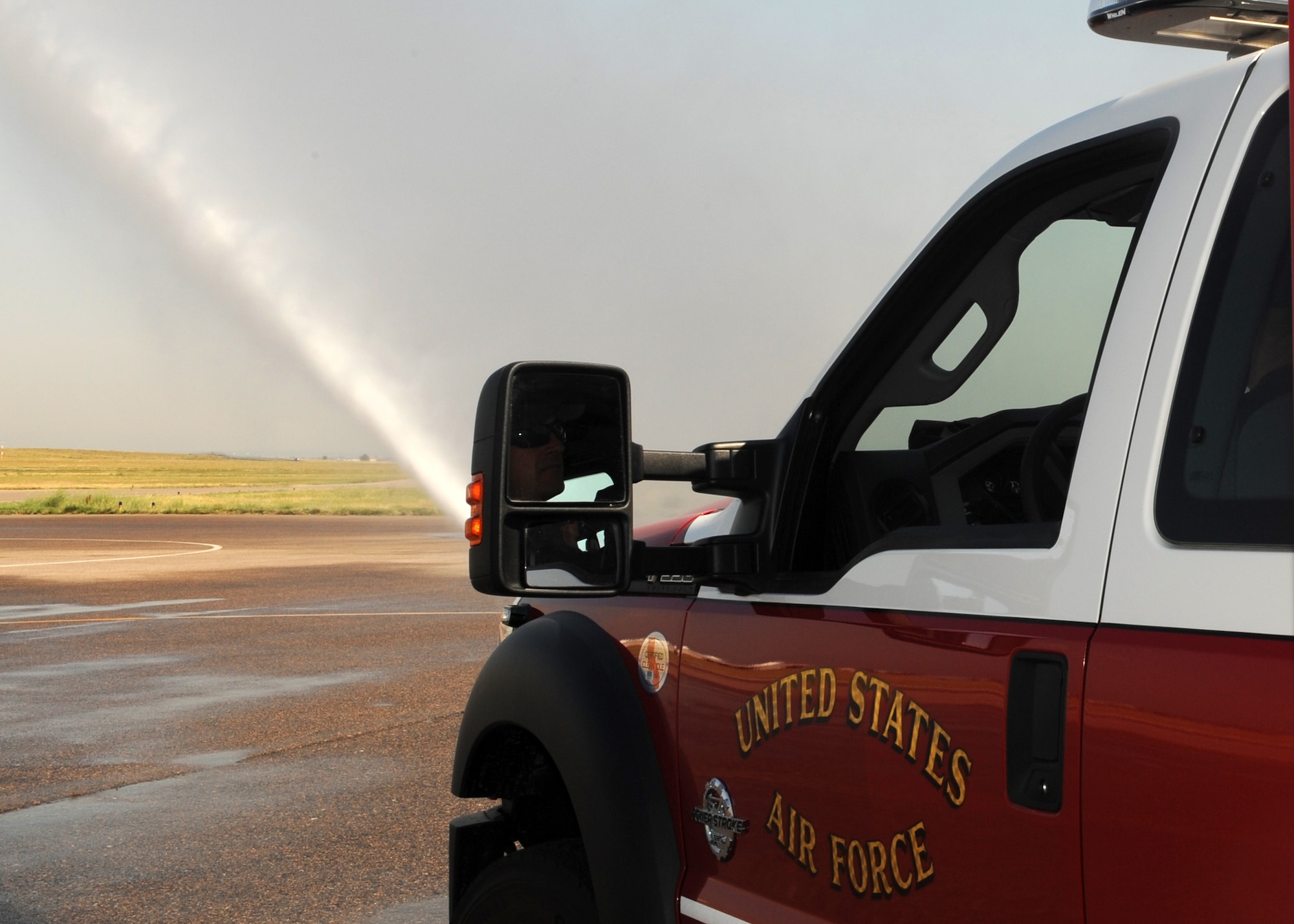 BUCKLEY AIR FORCE BASE, Colo. -- The Buckley Fire Department tests their new vehicle June 29, 2012. The new P-34 Rapid Intervention Vehicles uses high pressure technology to suffocate the fire with less water. (U.S. Air Force photo by Senior Airman Marcy Glass)
