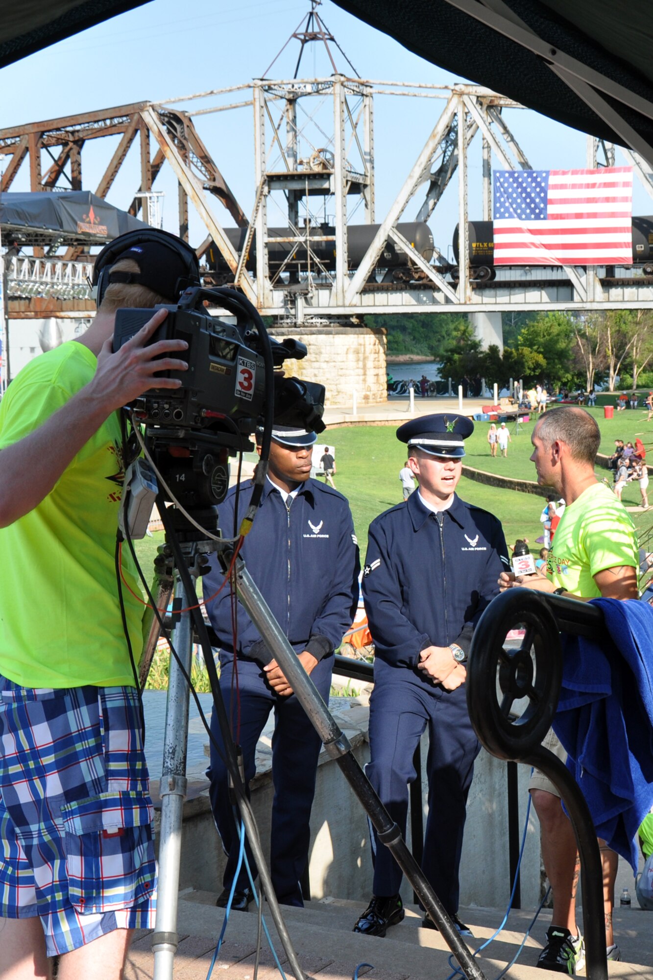 Members of the Barksdale Honor Guard are interviewed by a KTBS Channel 3 reporter before the official kick off of the Independence Day celebration in Shreveport, La., July 4, 2012. The Barksdale Honor Guard is from Barksdale Air Force Base, La., and posted the colors for the event. The celebration at Riverview Park in downtown Shreveport featured many types of food and beverage vendors, a musical concert, fireworks, and a flyover by a B-52 Stratofortress from the 307th Bomb Wing at Barksdale Air Force Base. La. (Courtesy photo by Roy Bell)